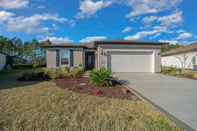 view of front facade featuring a garage, driveway, a front lawn, and stucco siding