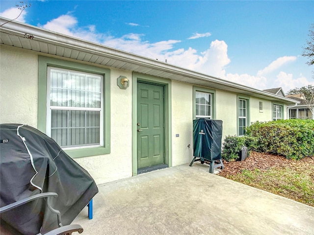 doorway to property featuring a patio