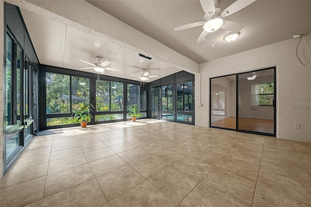 unfurnished sunroom featuring a healthy amount of sunlight