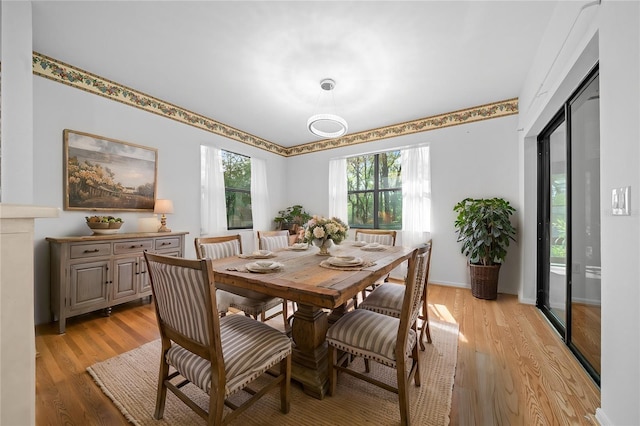 dining space with light wood-type flooring