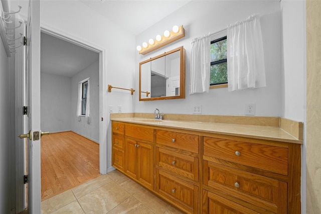 bathroom with vanity and tile patterned flooring