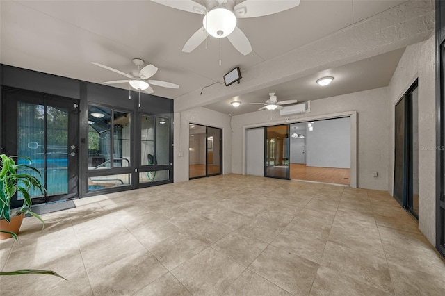 interior space with an AC wall unit and ceiling fan