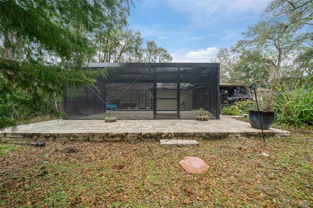 back of house featuring a patio and a lanai