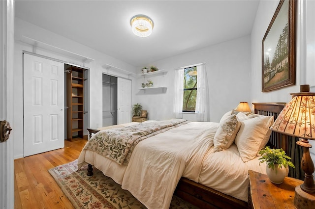 bedroom featuring light wood-style floors