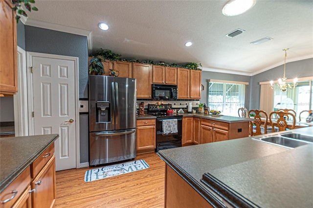 kitchen featuring light hardwood / wood-style flooring, a notable chandelier, black appliances, crown molding, and sink