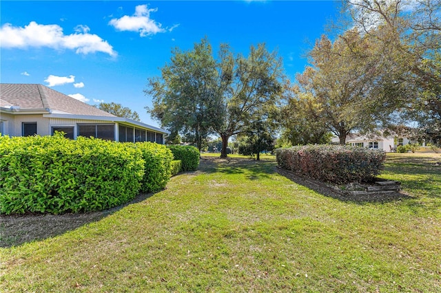 view of yard with a sunroom