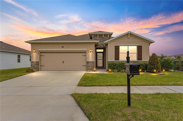 view of front of house with a lawn and a garage