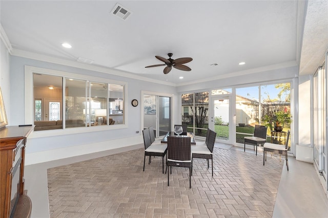 sunroom / solarium with ceiling fan