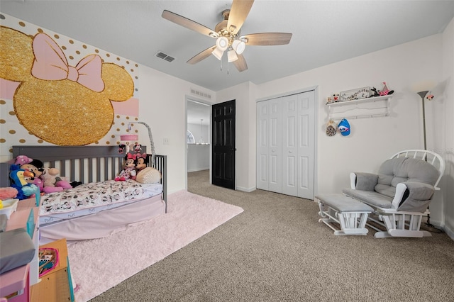 bedroom with a ceiling fan, carpet, visible vents, and a closet