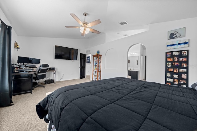 bedroom featuring arched walkways, light carpet, visible vents, a ceiling fan, and vaulted ceiling