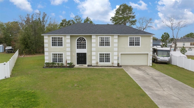 view of front of home featuring a front lawn, driveway, an attached garage, and fence