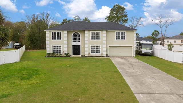 view of front of home featuring driveway, a front lawn, and fence