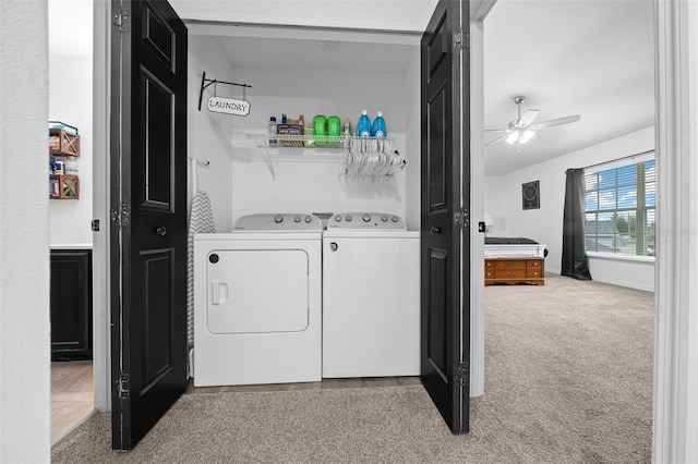 washroom with laundry area, baseboards, a ceiling fan, carpet flooring, and separate washer and dryer