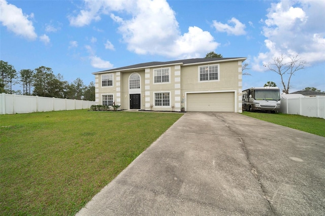 view of front of home with driveway, a garage, fence, and a front yard