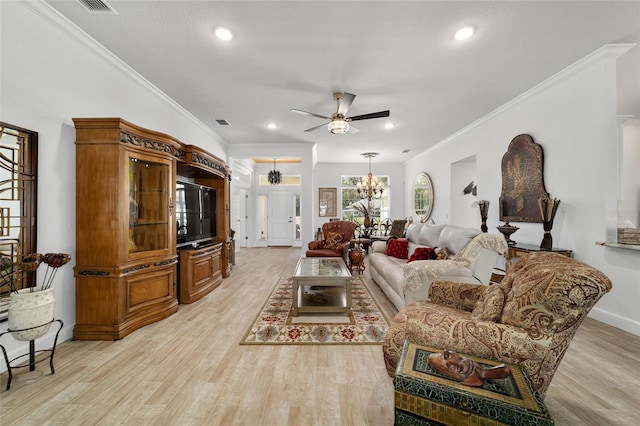 living room with ceiling fan with notable chandelier, light wood-type flooring, and crown molding