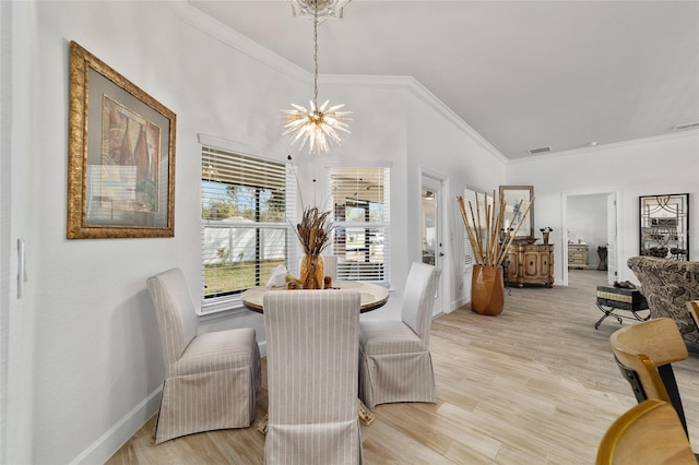 dining room featuring baseboards, light wood finished floors, visible vents, and a notable chandelier