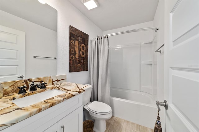 full bath with shower / bath combination with curtain, vanity, toilet, and wood finished floors