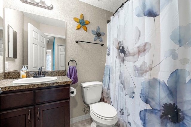 bathroom with tile patterned floors, toilet, vanity, and a shower with shower curtain