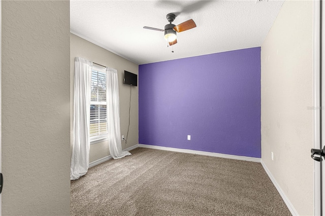 unfurnished room with carpet, a textured ceiling, and ceiling fan