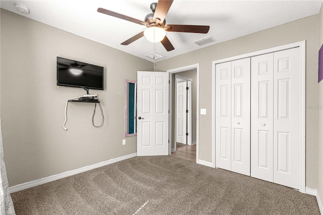 unfurnished bedroom featuring ceiling fan, carpet floors, and a closet