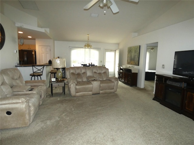 carpeted living room featuring lofted ceiling and ceiling fan