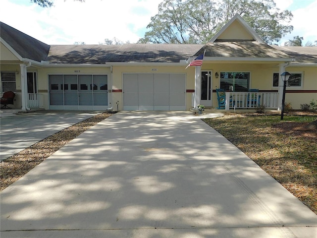 view of front of house featuring covered porch and a garage