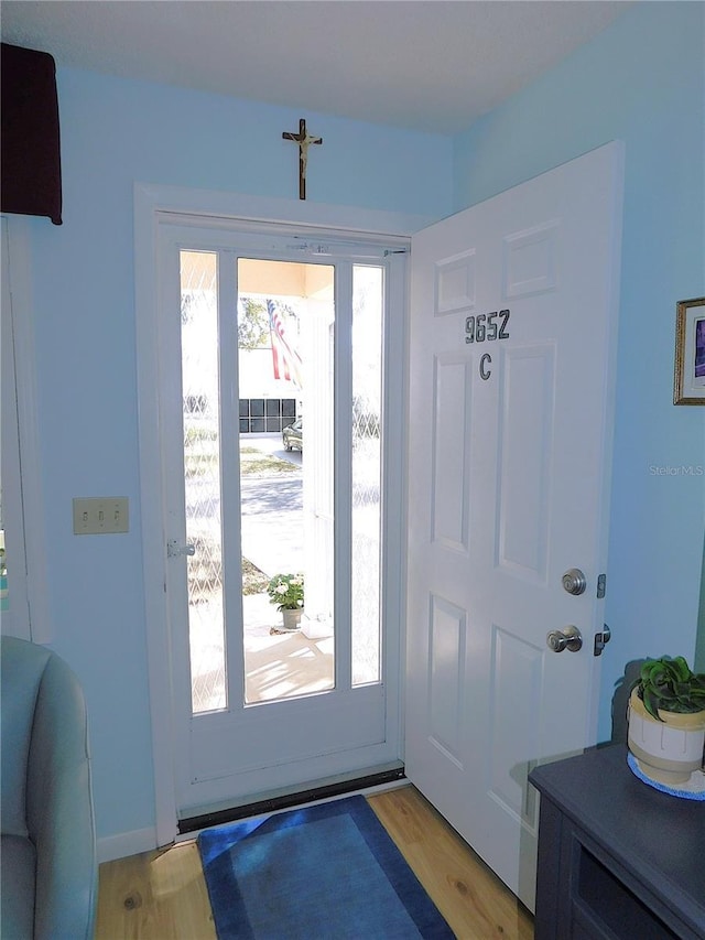 doorway to outside with light hardwood / wood-style floors