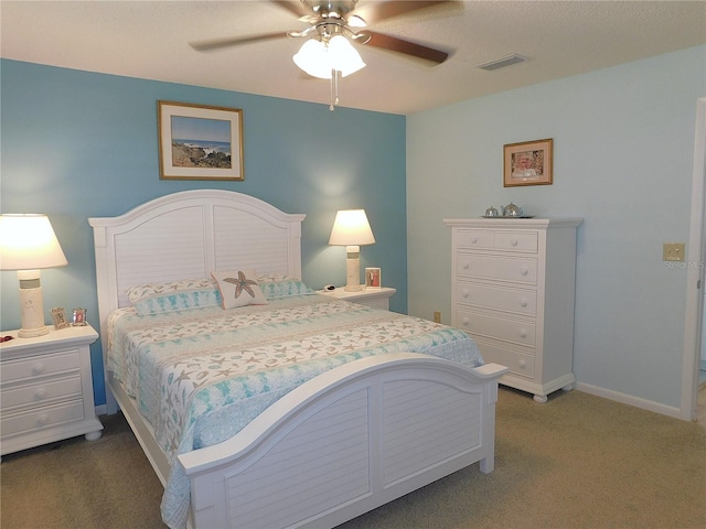 bedroom with ceiling fan and carpet floors