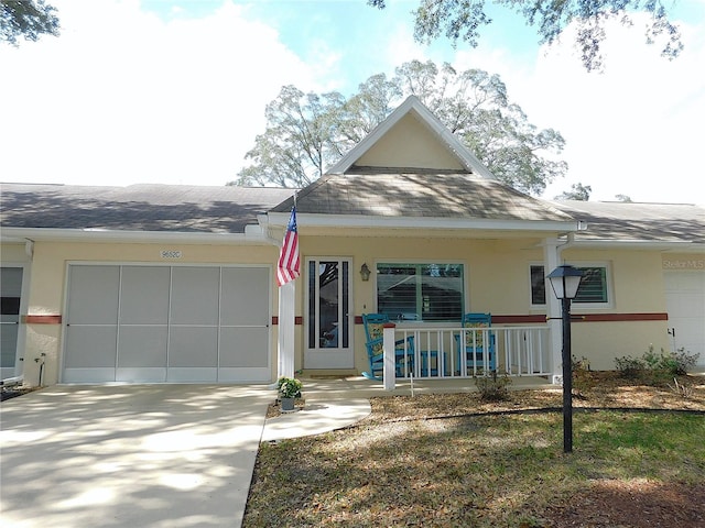 view of front of home featuring a porch and a garage