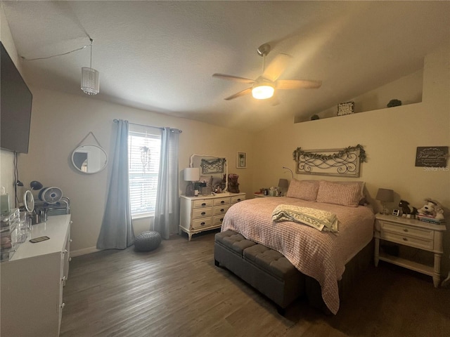 bedroom with vaulted ceiling, wood finished floors, and a ceiling fan