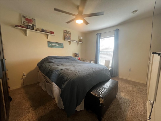 carpeted bedroom with a ceiling fan and baseboards