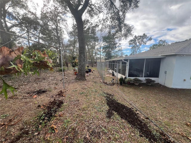 view of yard with a sunroom