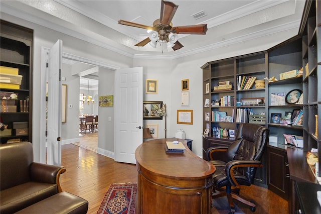 home office with hardwood / wood-style floors, ceiling fan, and ornamental molding