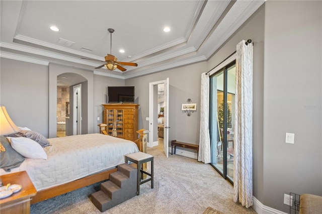 bedroom with access to outside, connected bathroom, a raised ceiling, crown molding, and light colored carpet