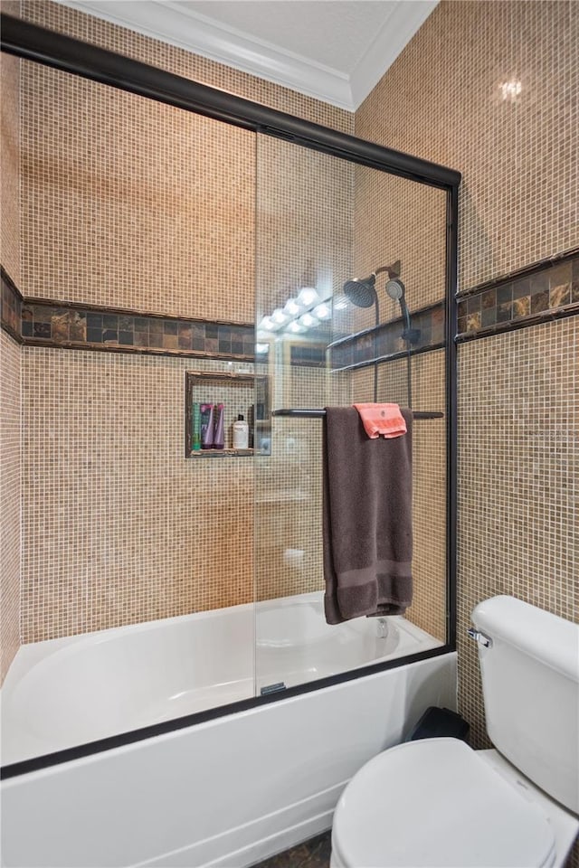 bathroom with toilet, tile walls, shower / bath combination with glass door, and crown molding