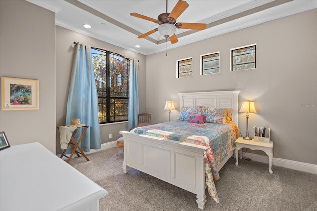 carpeted bedroom with ceiling fan and ornamental molding