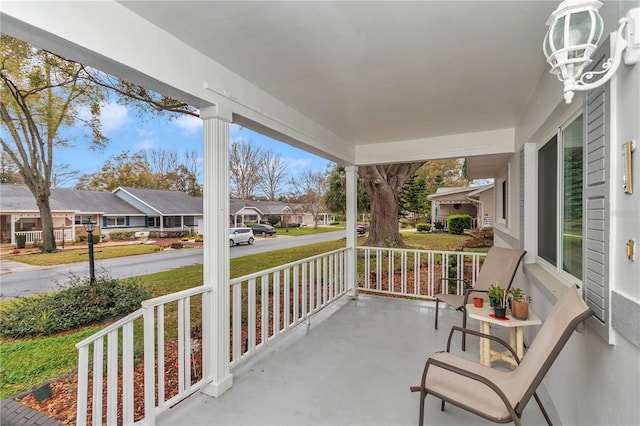 balcony with a residential view and covered porch