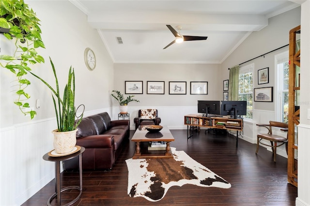living room with vaulted ceiling with beams, a ceiling fan, a wainscoted wall, visible vents, and wood finished floors