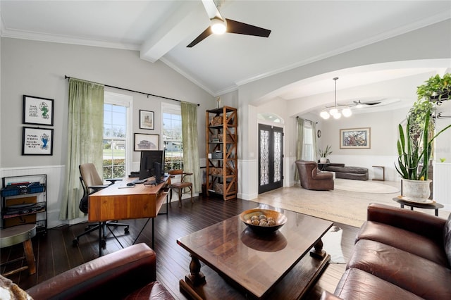 home office with arched walkways, hardwood / wood-style floors, and ceiling fan with notable chandelier