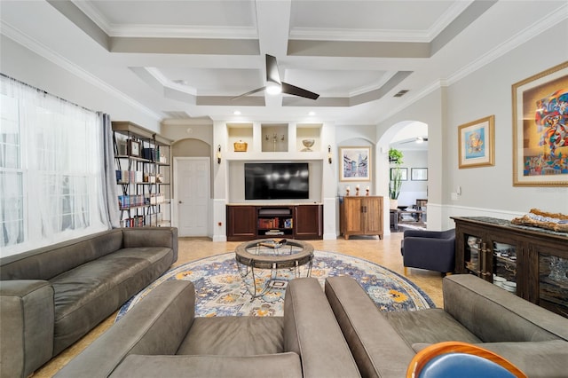 living area featuring ornamental molding, coffered ceiling, arched walkways, and ceiling fan
