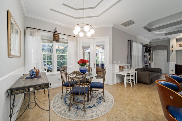 dining room with visible vents, french doors, crown molding, and a tray ceiling