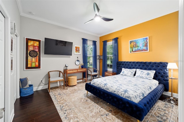 bedroom with wood finished floors, a ceiling fan, ornamental molding, and baseboards