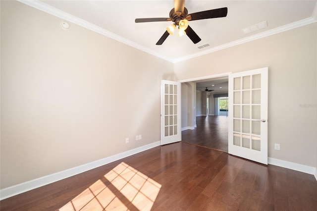 spare room featuring french doors, wood finished floors, visible vents, and baseboards