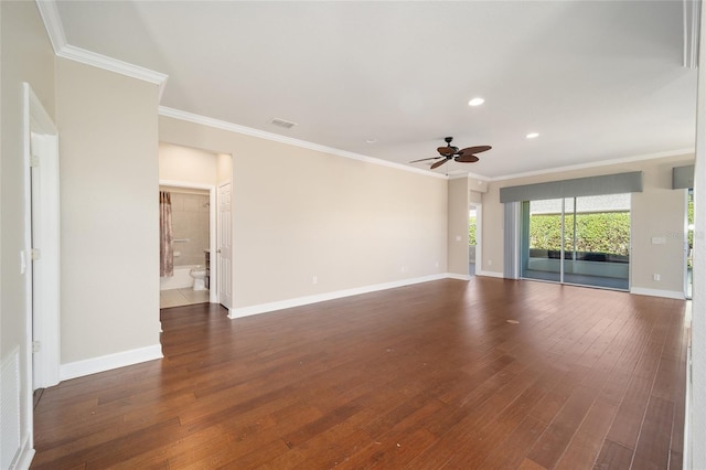 empty room with ornamental molding, dark wood-style flooring, and baseboards