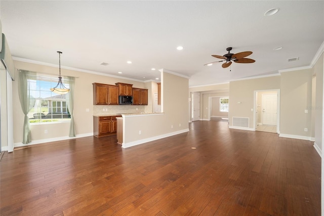 unfurnished living room featuring dark wood finished floors, visible vents, and baseboards