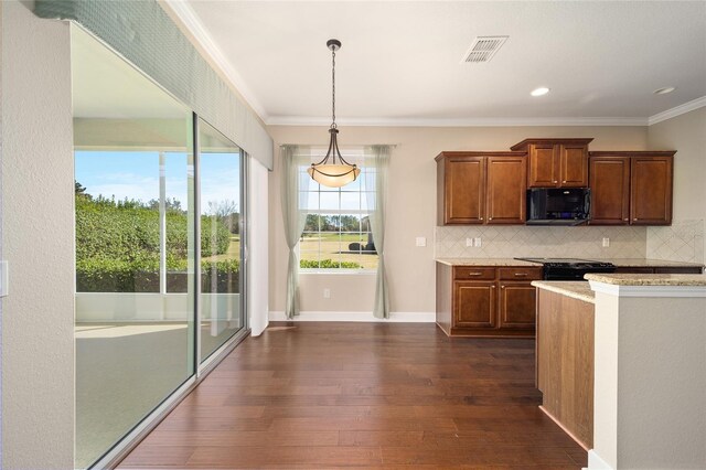 kitchen featuring decorative light fixtures, visible vents, decorative backsplash, dark wood-type flooring, and black appliances