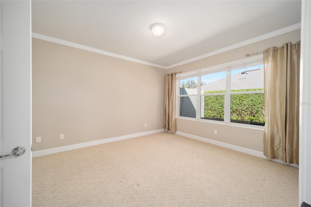 spare room featuring light carpet, baseboards, and ornamental molding