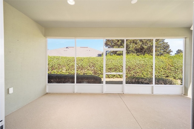 unfurnished sunroom with a wealth of natural light