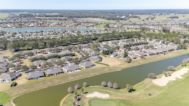 drone / aerial view with a water view and a residential view