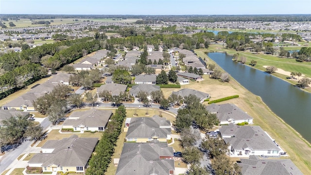 birds eye view of property featuring a water view and a residential view